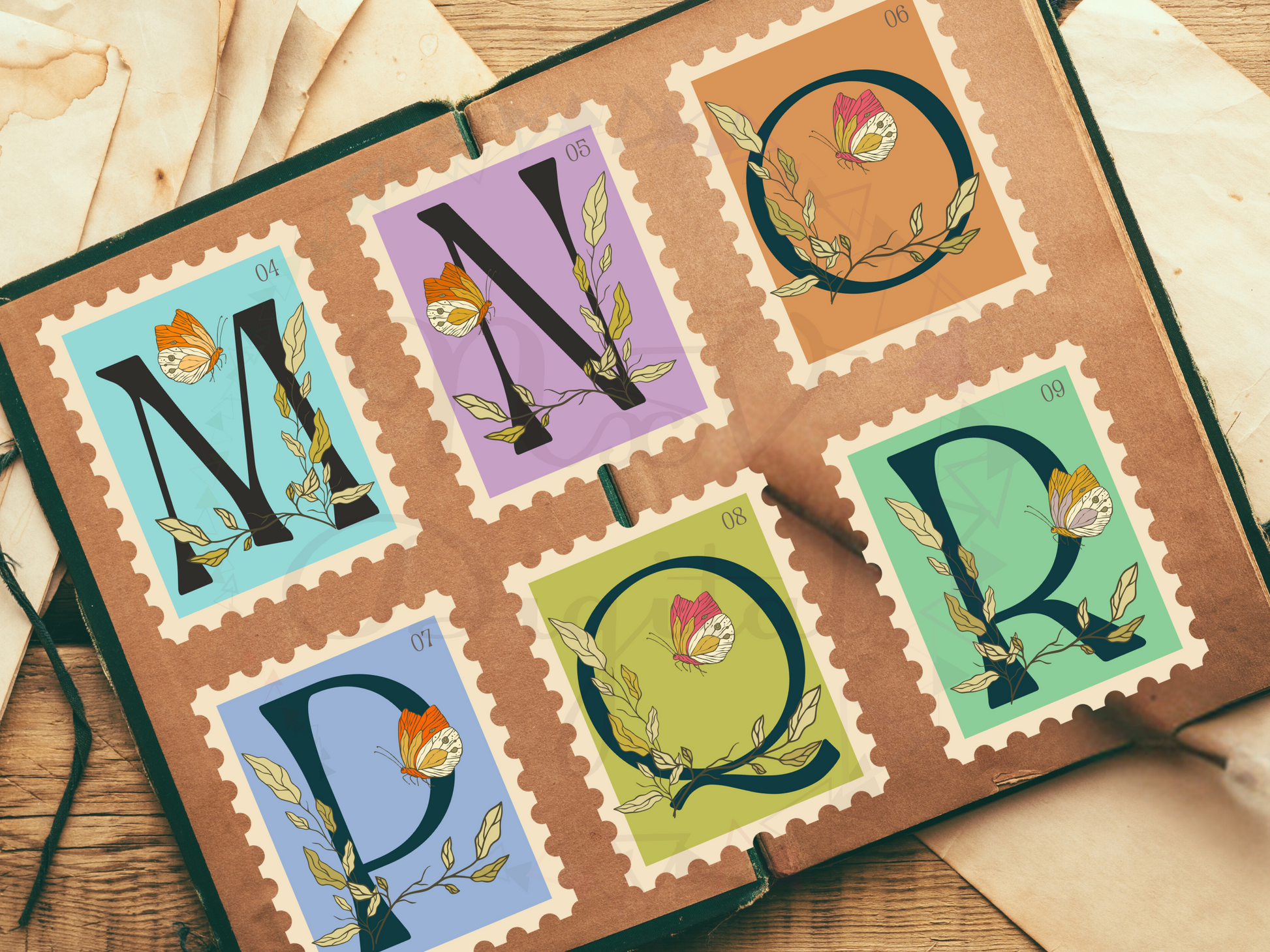 m to r alphabet stamp design on old junk journal book